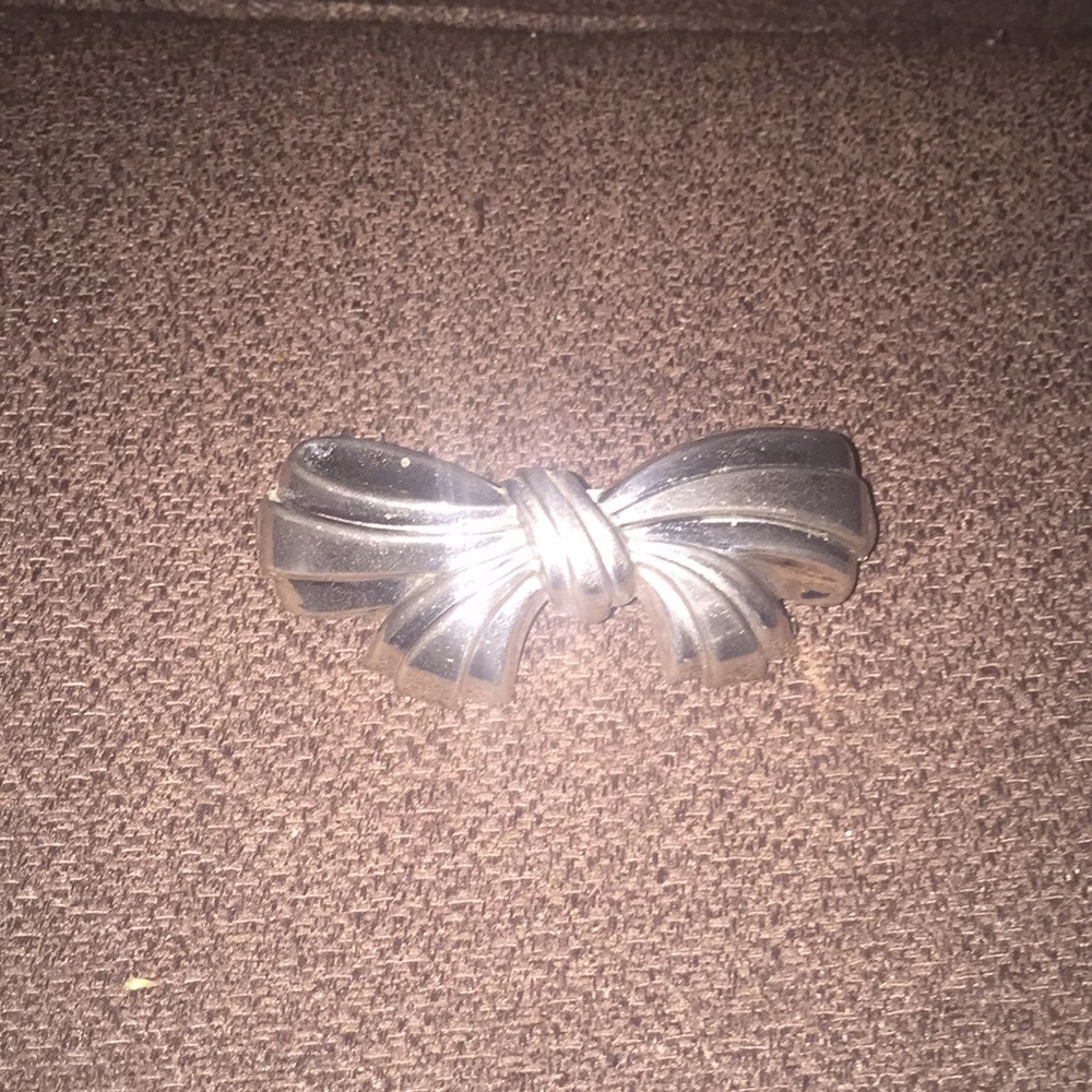Classic silver bow hair clip approx 3” long.